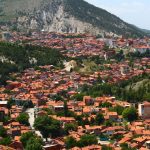 aerial view of city near mountain during daytime